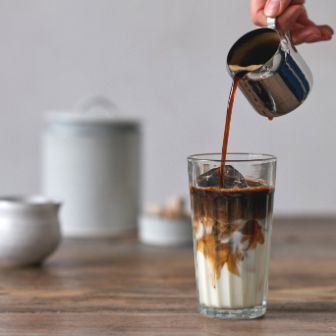 pouring coffee in milk