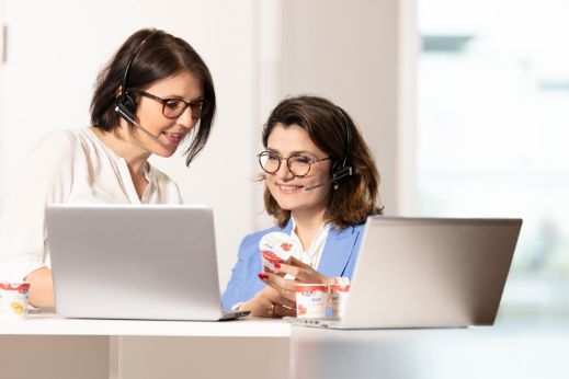 consumer-services-women-standing-desk-contact